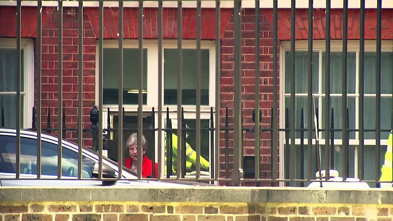 May departs Downing Street after resignation statement