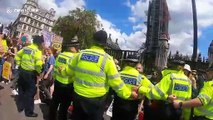 Young climate activists seen shouting at police officers, London UK