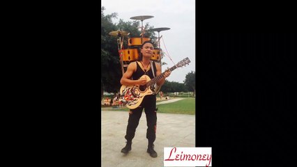 A man became a band.drum guitar and singing,very good