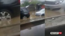 Reshje të dendura shiu/ Përmbytje pranë ujësjellësit në Kombinat, demtohen dy automjete