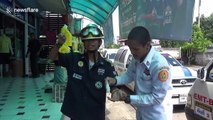 Four dogs rescued after allegedly being dumped in narrow gap between two buildings, Thailand