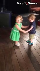 Adorable First Kiss Between Cute Baby Girl and Baby Boy