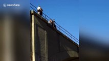 US man performs double front flip from horse's back off a bridge