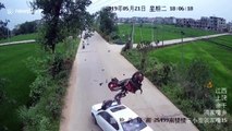Motorcycle flips through the air after head-on car crash, throwing rider onto bonnet