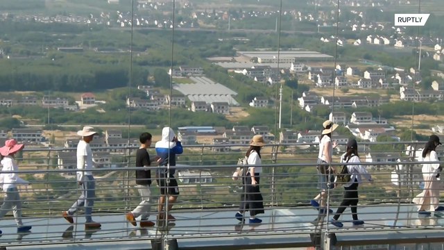 Don't look down! Tourists brave world’s longest glass bridge in China