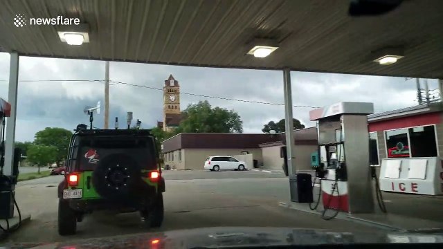 Tornado sirens wail as a storm chasers prepare in Beloit Kansas, USA