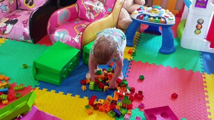 Kristen and Scarlett playing with color blocks and other toys