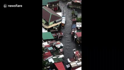 Locals rush to salvage possessions as rainy season floods hit the Philippines