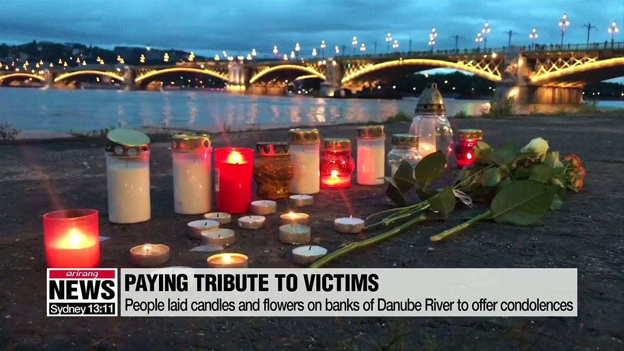 Candles laid on banks of Danube as hope dims for missing in Budapest boat disaster