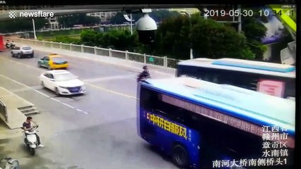 Men escape death after large crane flips over in China’s Jiangxi