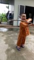 The child practices martial arts to train his body with a very excited spirit