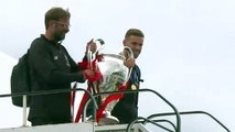 Liverpool players arrive home following Champions League win