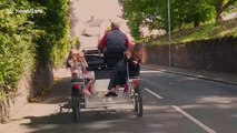 Travellers ride their horse-drawn carts ahead of the Appleby Horse Fair