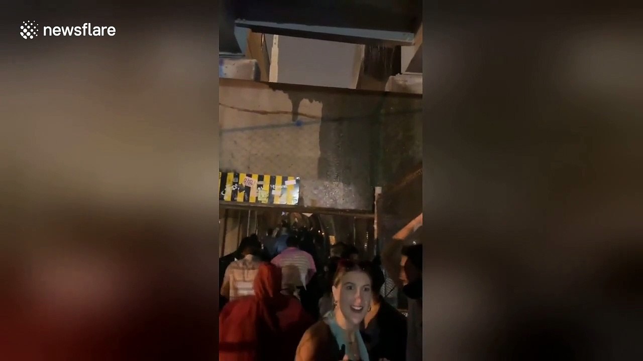 US storm floods bridge as Governors Ball festival-goers sprint towards exit