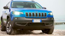 Jeep Cherokee in Blue On Road Driving