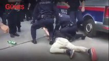 Avusturya'da polis eylemcinin kafasını aracın altına sokup 'sür' dedi
