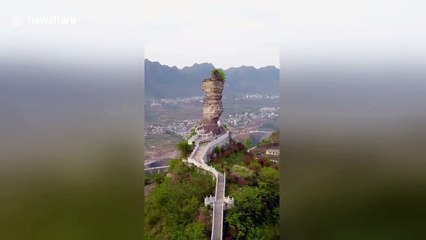 Mysterious giant stone has stood on mountaintop for thousands of years in China