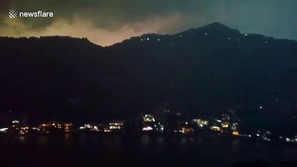 Lightning strike from storm ignites forest floor in India