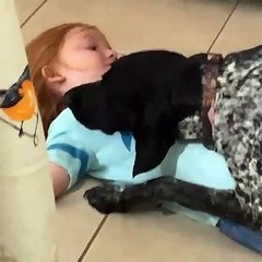 Dog and Daughter Cuddle Adorably