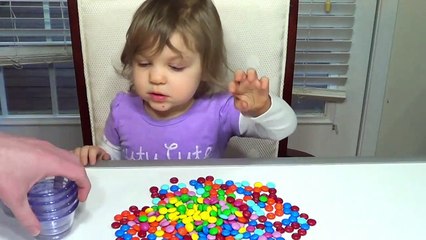 Genevieve Plays with M&M's