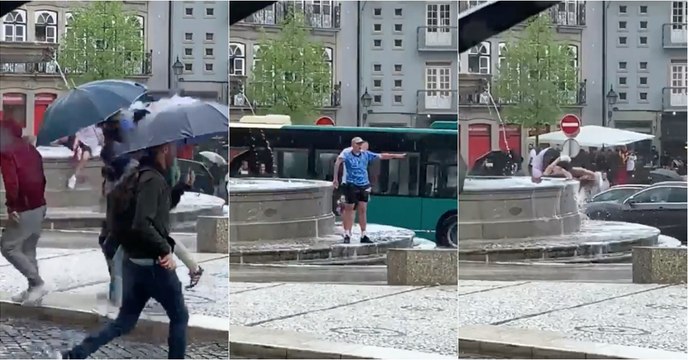 Adeptos ingleses mergulham no Largo do Toural em Guimarães