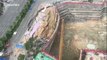 Destroyed road collapses onto a construction site in southern China