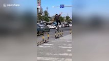 Daredevil unicyclist balances on roadside guardrails in China