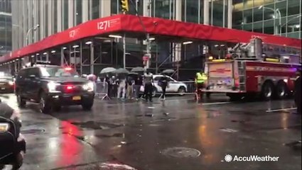 Fire engines and police vehicles pass through New York streets following helicopter crash