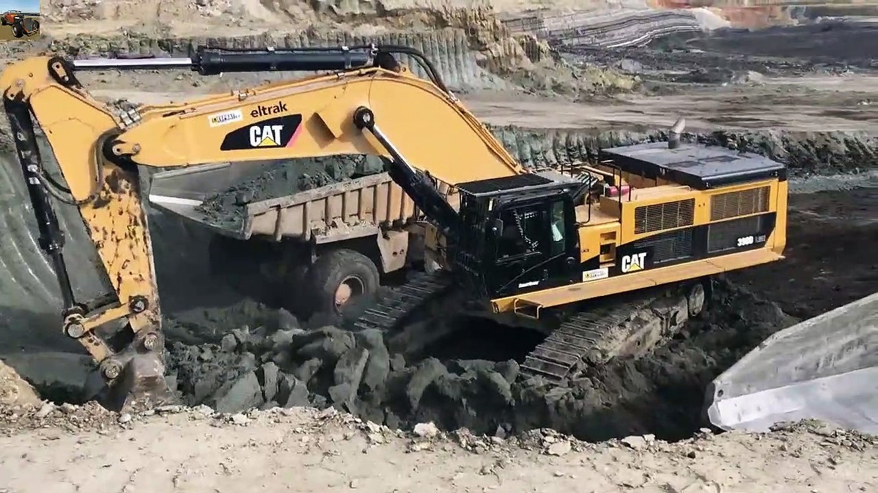 Excavator Loading Cat Dumpers On Coal Mines- (1)