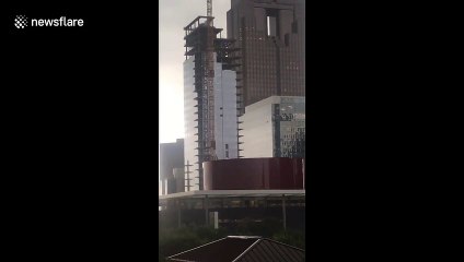High winds blow out windows of skyscraper under construction in Dallas