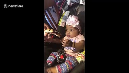 Cute hungry baby excited to try her first rib