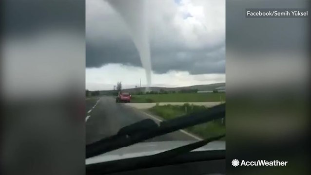 Stunning cone tornado tears across field in Turkey