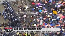 Hong Kong police declare China extradition protest 'a riot' as rubber bullets and tear gas fired at crowd