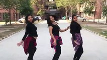 three sisters dancing on street