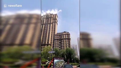 Chinese residential community sprays water from skyscrapers to combat heat wave