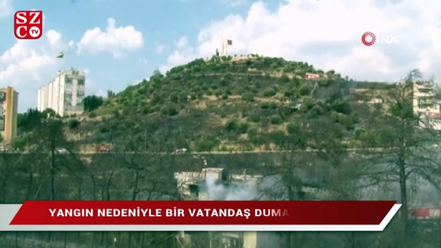 İzmir’de zeytinlik alanda başlayan yangın 2 eve sıçradı