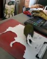 Hungry bird eats up office paper