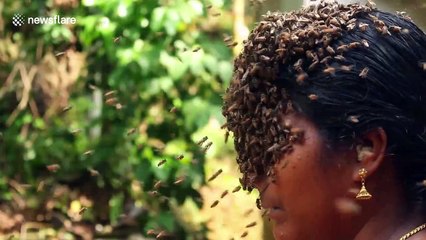 Indian woman covers face with hundreds of bees to create buzz for conservation
