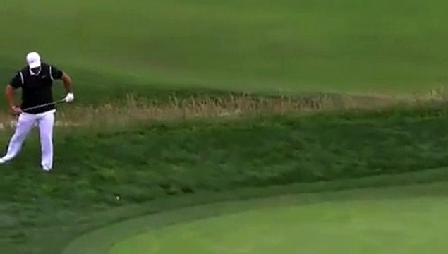 Golf - US Open - Patrick Reed snaps the club over his knee