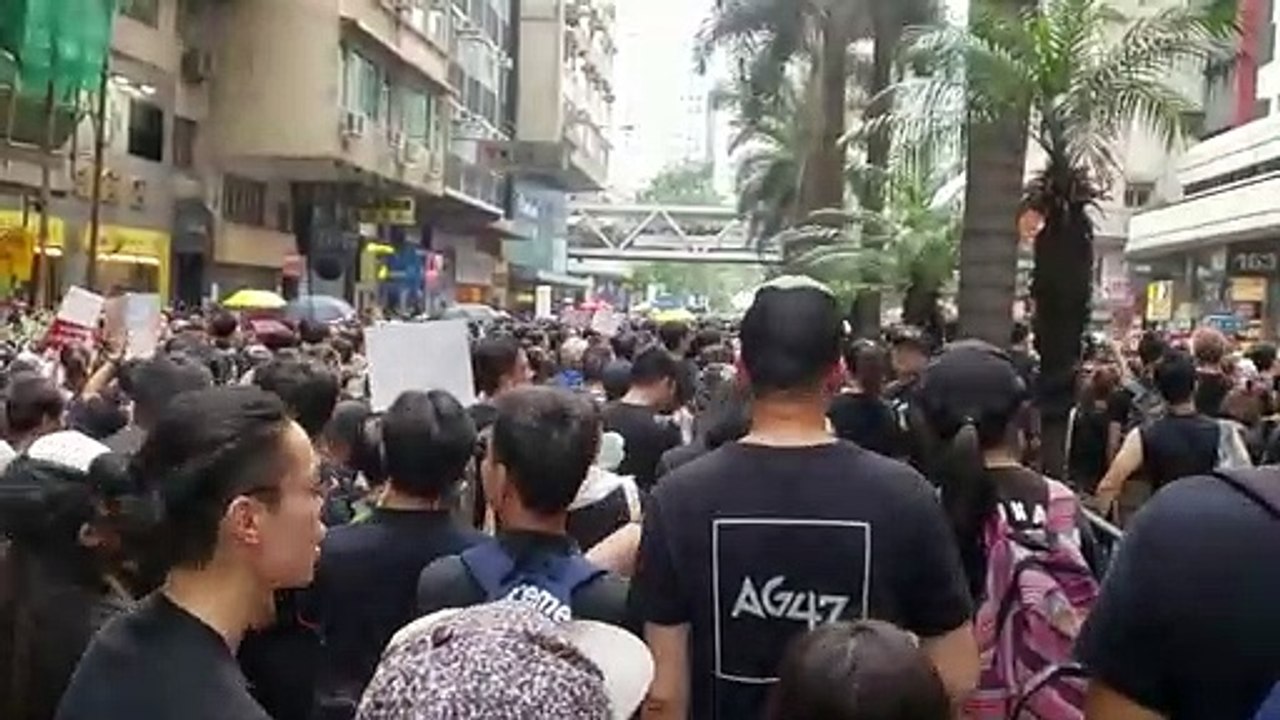 Thousands in black choke Hong Kong's city centre in rally to demand Carrie Law's resignation