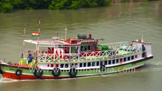 Cargo Ships and safari boats in Datta river , Sundarban, West Bengal , India, 4k stock footage