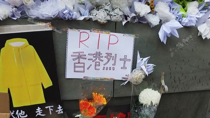 Pavement covered with tributes to ‘Raincoat Man’ after mass march in Hong Kong