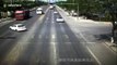 Truck driver narrowly avoids flattening car after changing directions quickly in China