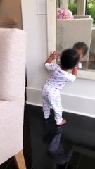 True Thompson Plays Peek-a-boo With Herself In The Mirror