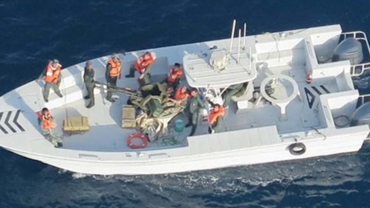 US military releases new images of ‘Iranian forces removing unexploded mine’ from ship near Strait of Hormuz