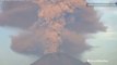 Volcano erupts sending ash and debris miles into sky