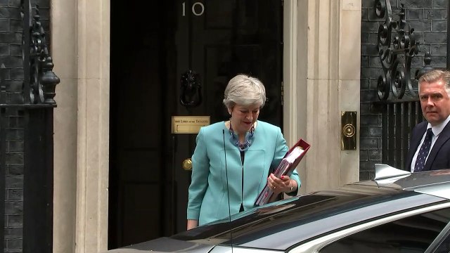 Theresa May departs Downing Street ahead of PMQs