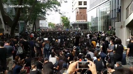Thousands of protesters surround police headquarters in Hong Kong