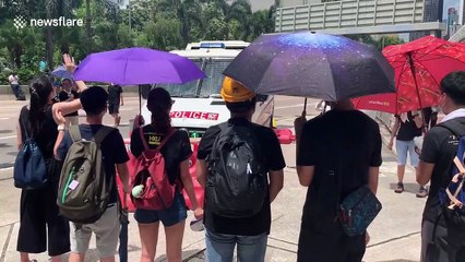 Hong Kong protesters block police van