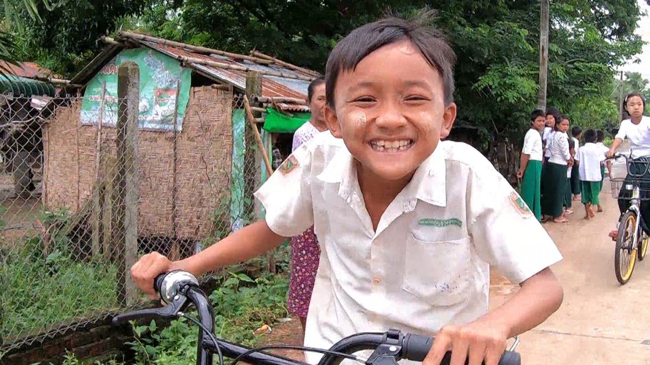 Myanmar children getting to school on recycled bike-sharing stock from Singapore and Malaysia